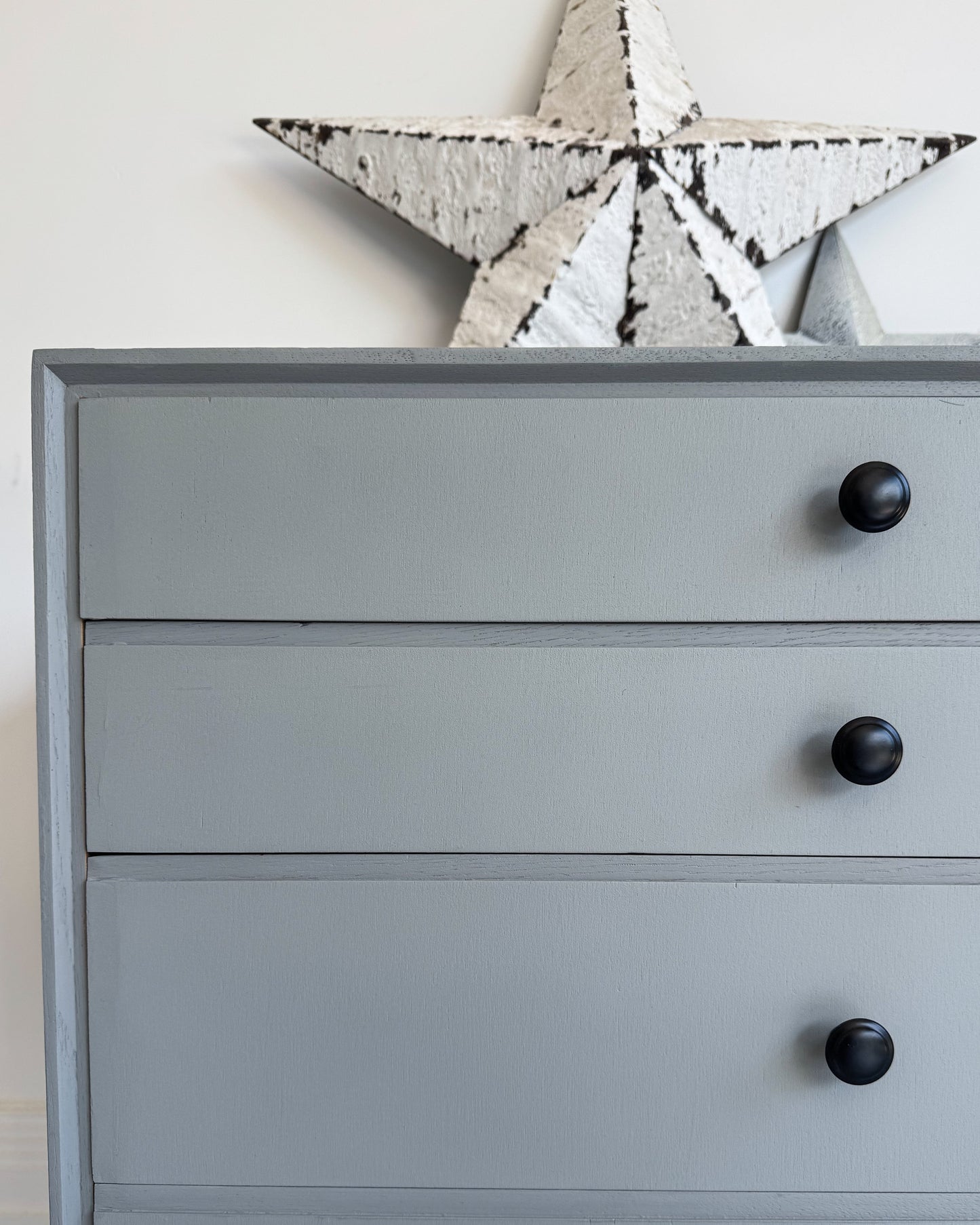 Close-up of drawers finished in Highland Haze grey by Small & Co furniture paint, showing smooth eggshell finish with black knobs – ideal for upcycling and DIY furniture projects.