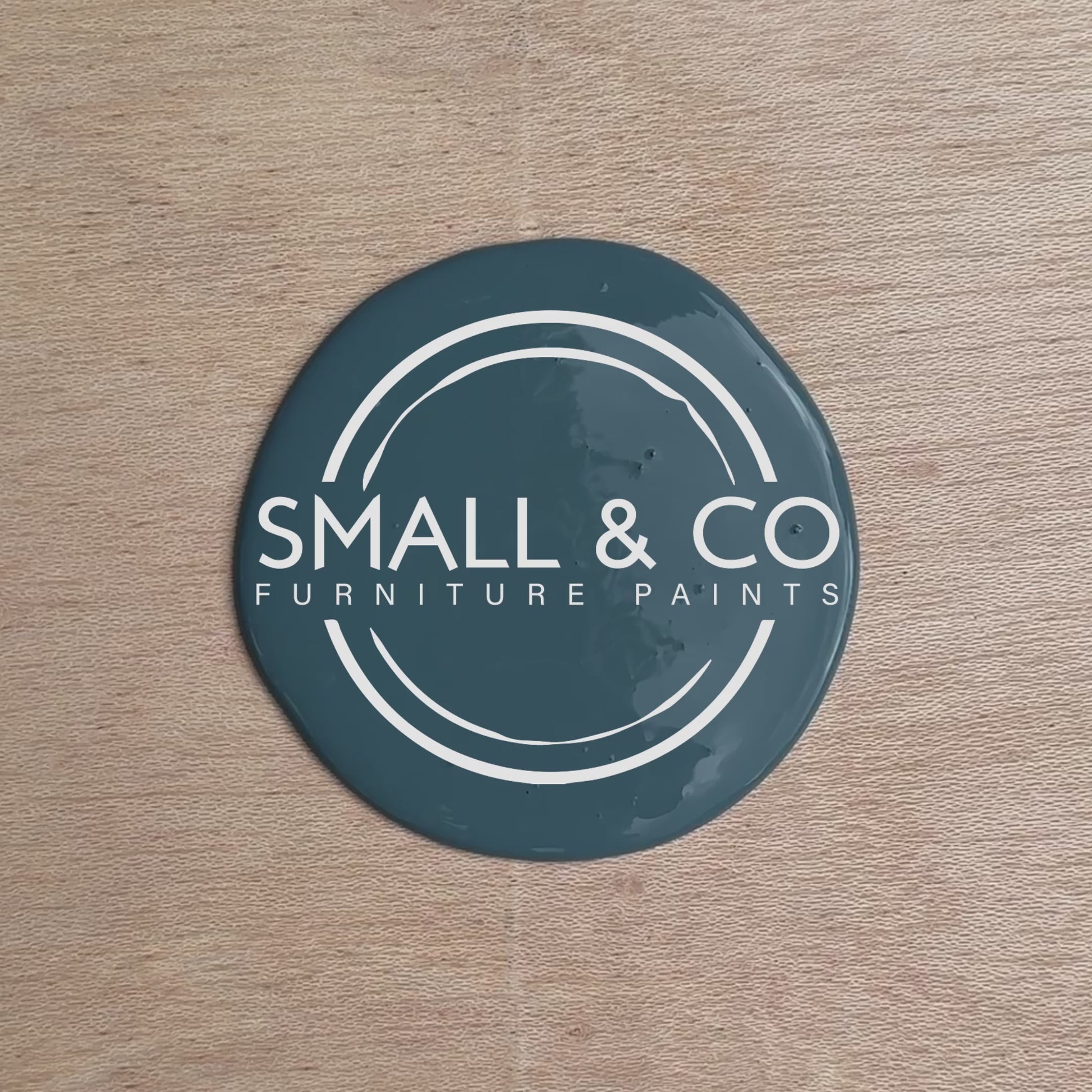 Hand splashing in vibrant Beacon Blue furniture paint by Small & Co, demonstrating the rich colour and smooth texture