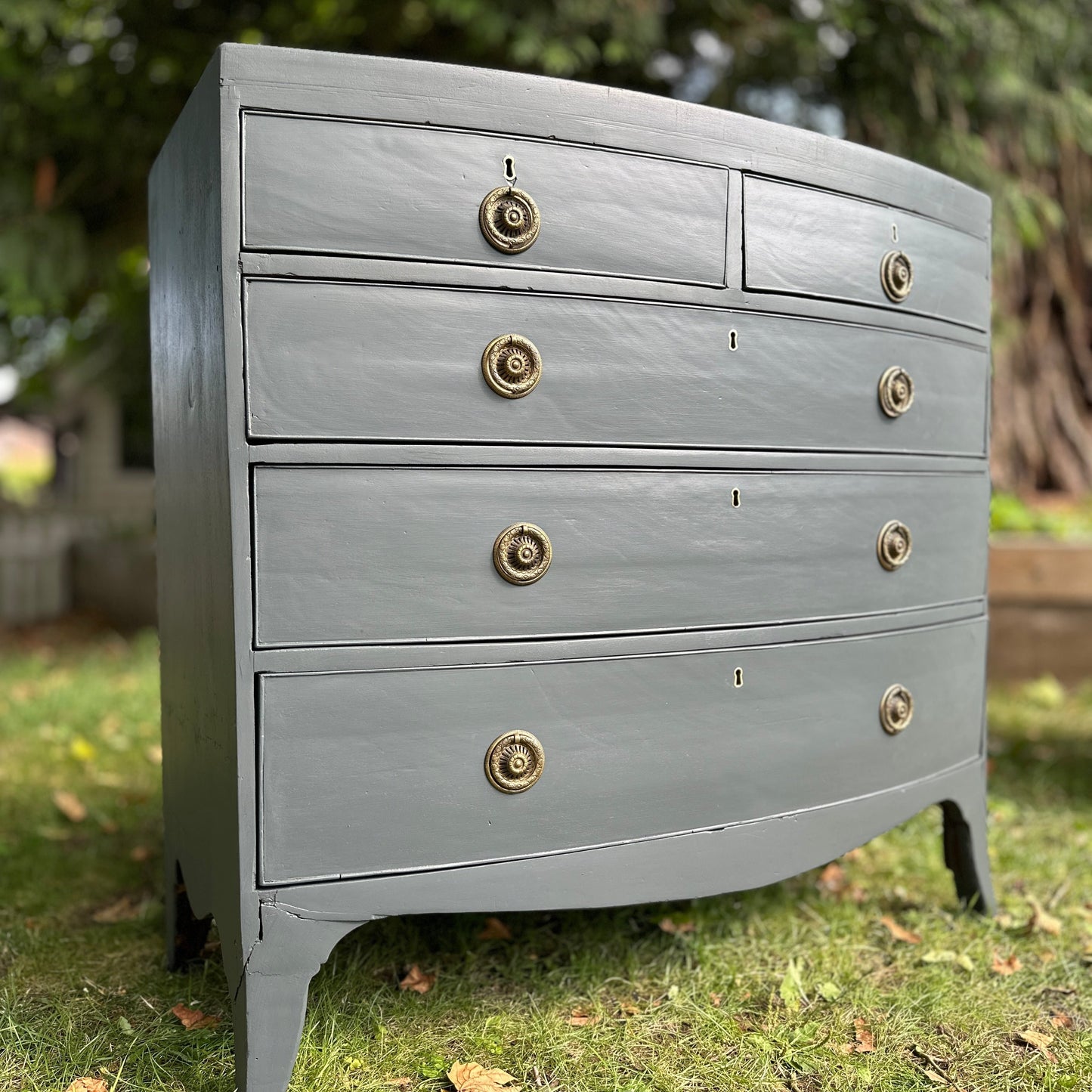 Hand painted victorian bow fronted chset of drawers pained in iron bridge, a charcoal grey, nearly black coloured furniture paint by small and co furniture paints, a uk made paint company