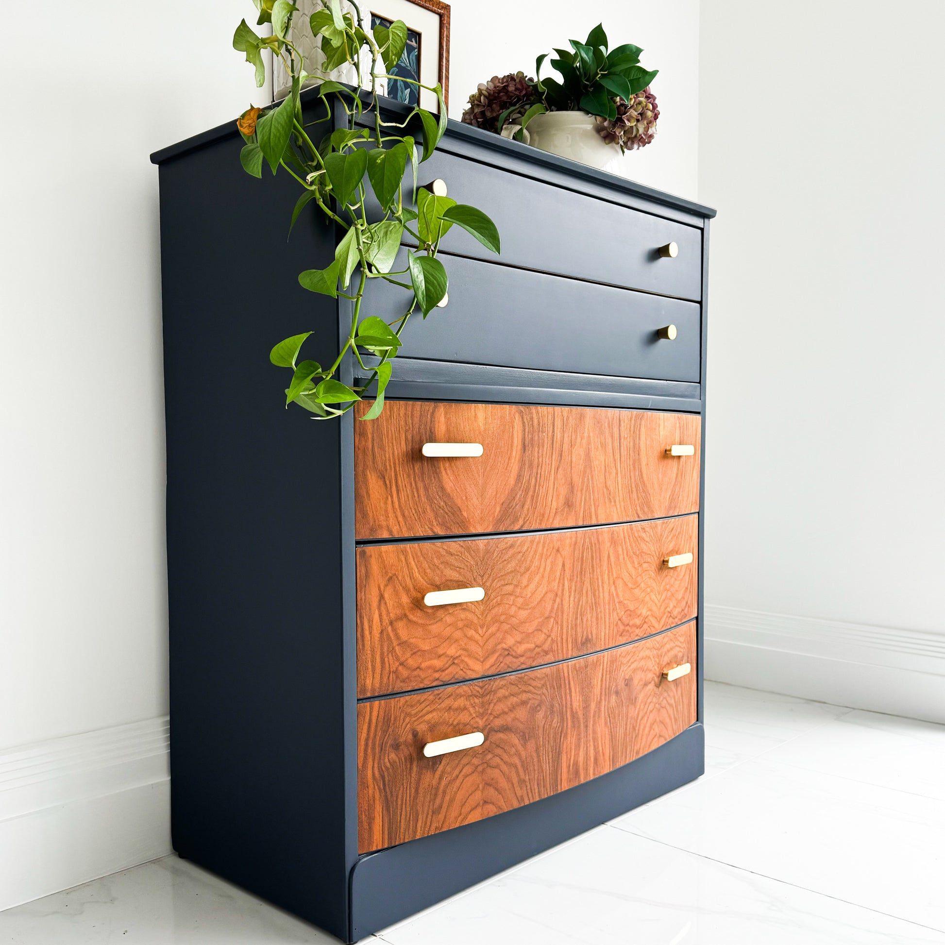 side on angle of a mid century lebus chest of drawers painted in Royal navy colour by small and co furniture paints, a midnight blue, squid ink paint colour