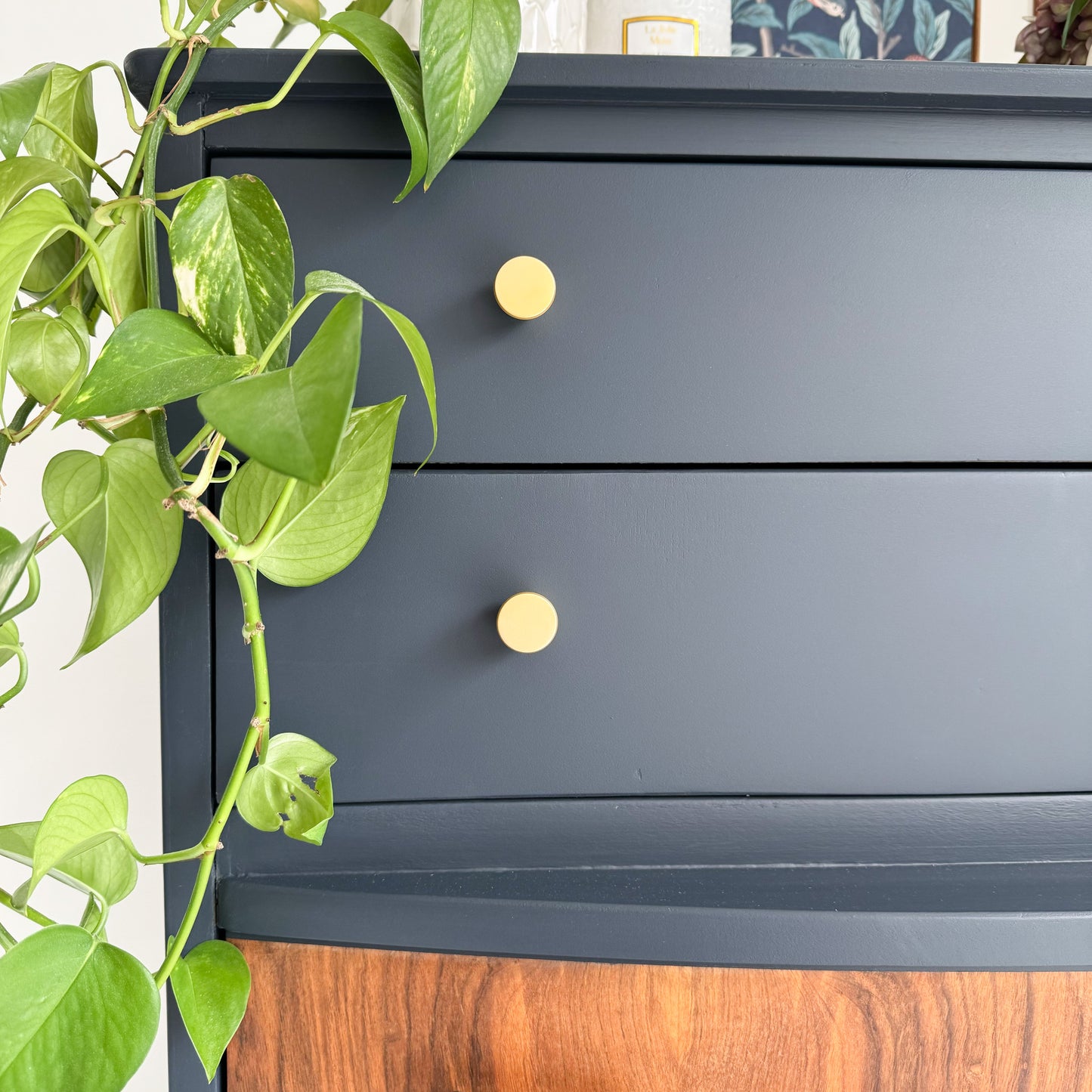 Midnight Blue, Squid Ink colour furniture paint called Royal Navy by small and co furniture paints, painted on a vintage mid century chest of drawers, image showing close up of dark blue drawers and gold handles